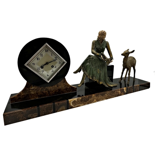 75 - Art Deco French black slate figural mantel clock mounted by a seated female and deer, with two train... 