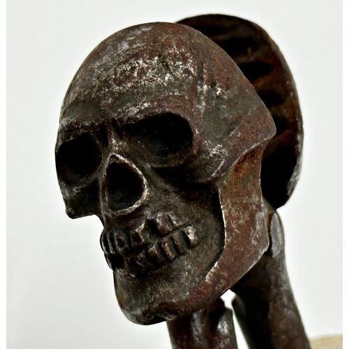 373 - Good novelty iron skull and bones nutcracker, 15.5cm long