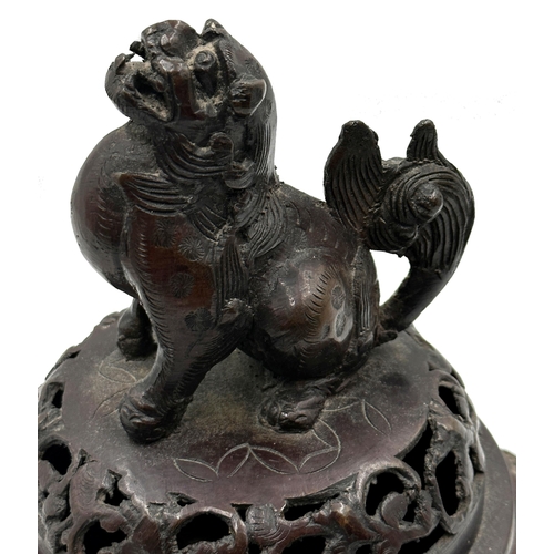 520 - Japanese bronze lidded Koro, mounted by a temple god, cast in relief with birds and twin elephant ha... 