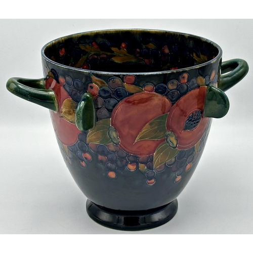 496 - Large early Moorcroft twin handled vase with four lugs in pomegranate pattern, 22cm high