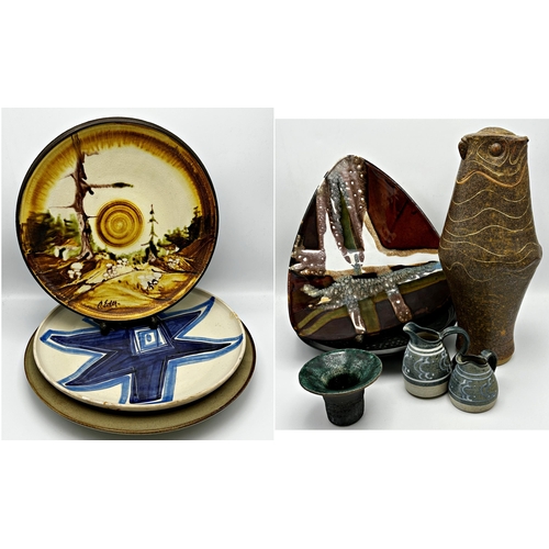 489 - A collection of pottery to include an Alison Botherwick owl vase, three large chargers, small raku v... 