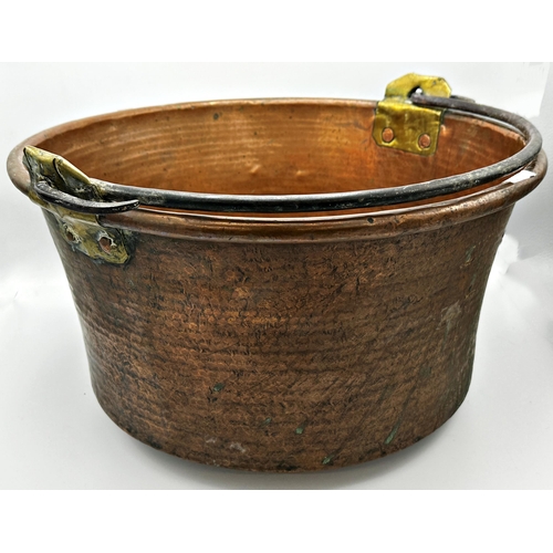 660 - Large Eastern copper log bucket with rivetted brass supports and iron handle, 49cm diameter