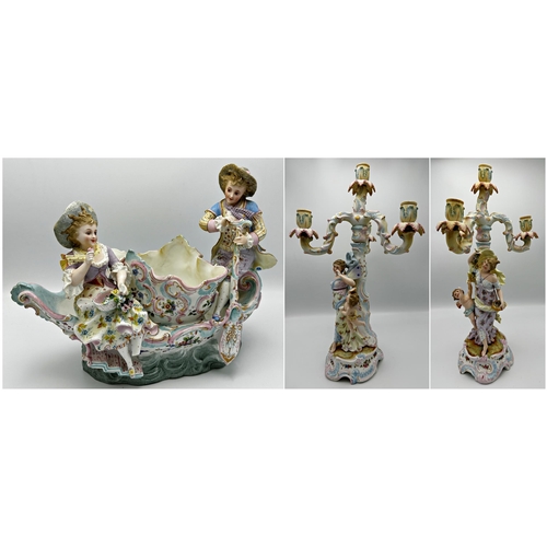 466 - Continental three piece bisque porcelain garniture comprising centerpiece of lovers on a boat around... 