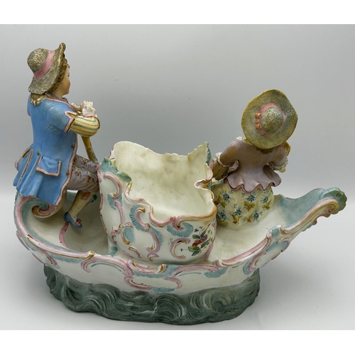 466 - Continental three piece bisque porcelain garniture comprising centerpiece of lovers on a boat around... 