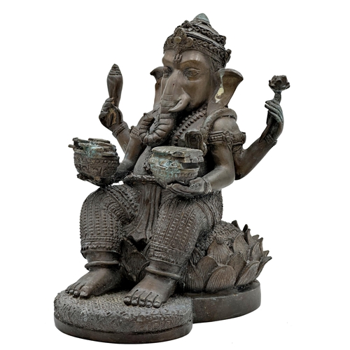 511 - Eastern bronze study of Ganesh seated on a lotus flower, 22cm high