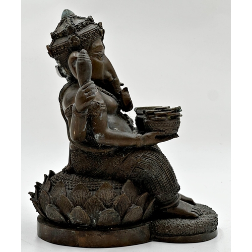 511 - Eastern bronze study of Ganesh seated on a lotus flower, 22cm high