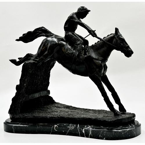 612 - Bronze character group of jockey and rider jumping a fence, upon a black shaped marble base, 32cm hi... 