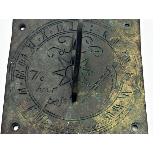 613 - Antique bronze sundial dated 1639 with indecipherable incised inscription, 15 x 15cm