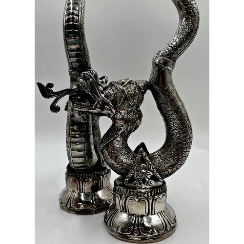 512 - A pair of far Eastern silver plated floor standing candlesticks in the form of coiled serpents, 60cm... 