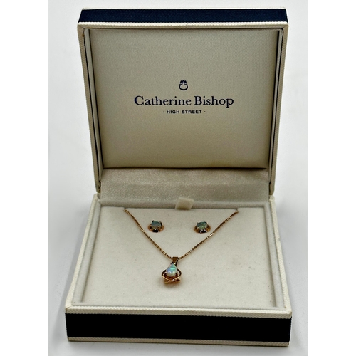 118 - 9ct and opal suite comprising pendant on chain and pair of earrings, the chain 40cm long, 3.4g