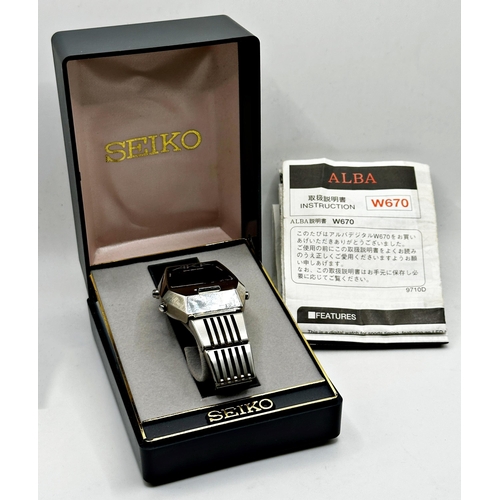 19 - Seiko AKA Alba stainless steel gents 'Space Watch' W670-4000, box and instructions in working order