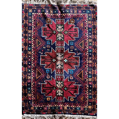 1578 - Good Afghan rug, three red medallions on a navy blue ground, L153 x W87cm