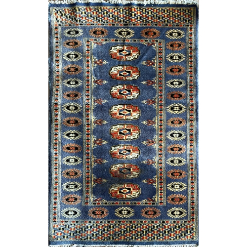 1582 - Bokhara runner, line of medallions on blue ground, L102 x W61cm