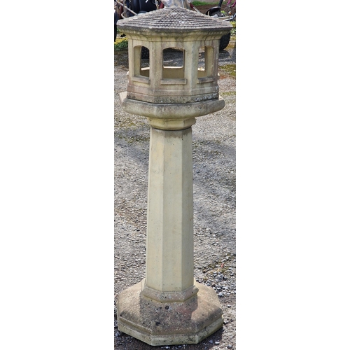 1040 - Reconstituted stone three sectional bird table/dovecot of octagonal form with simulated tiled roof a... 