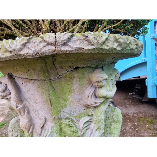 1054 - Pair of reconstituted stone garden urns with relief moulding, planted, 100cm high including plant, (... 