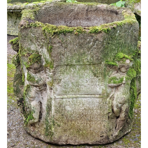 1058 - Well weathered octagonal garden planter with inscribed front panel, decorated with various figures, ... 