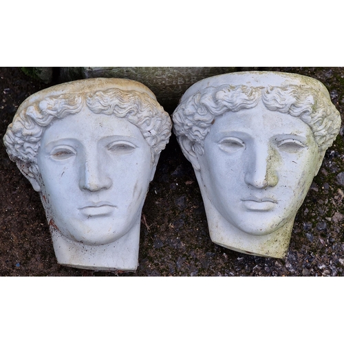 1061 - Pair of reconstituted stone wall hanging face masks, 20cm high