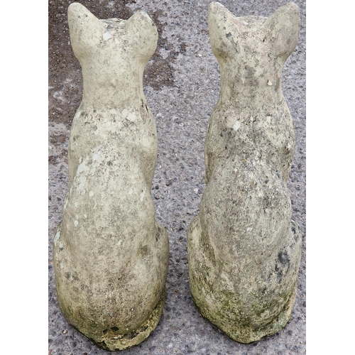 1065 - Pair of reconstituted stone garden ornaments in the form of Siamese cats, 55cm high