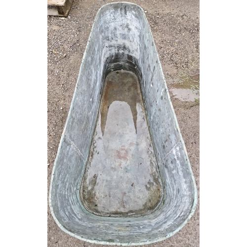 1069 - Vintage galvanised trough of triangular form with rivetted seams, 63cm high x 131cm wide