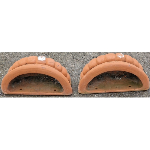 1070 - Pair of terracotta wall planters with lobed bowls, 17cm high x 42cm wide