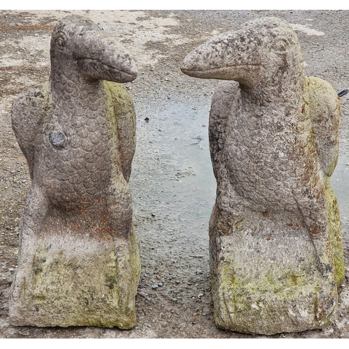 1076 - Pair of weathered garden ornaments in the form of ravens, 61cm high