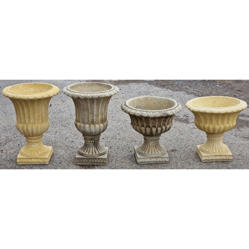 1082 - Willowstone - Two pairs of garden urns with gadrooned detail and flared rims, raised on fluted socle... 