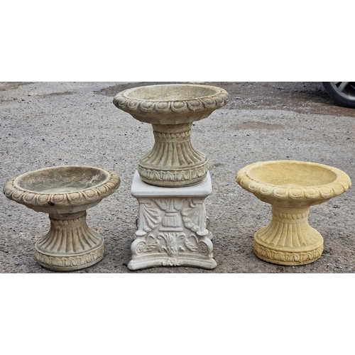 1086 - Three reconstituted stone bird baths with fluted socles plus a square pedestal base, 30cm high  (4)