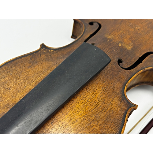 729 - 19th century violin, the label inside for 'Nicolaus Amati', 60cm long, with two bows (3)