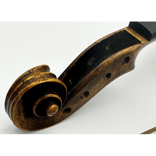 729 - 19th century violin, the label inside for 'Nicolaus Amati', 60cm long, with two bows (3)