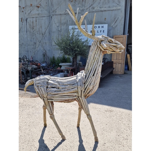 1117 - A large impressive driftwood sculpture of a stag, 212cm high