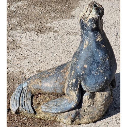 1120 - Weathered reconstituted stone water feature in the form of a seal, 42cm high