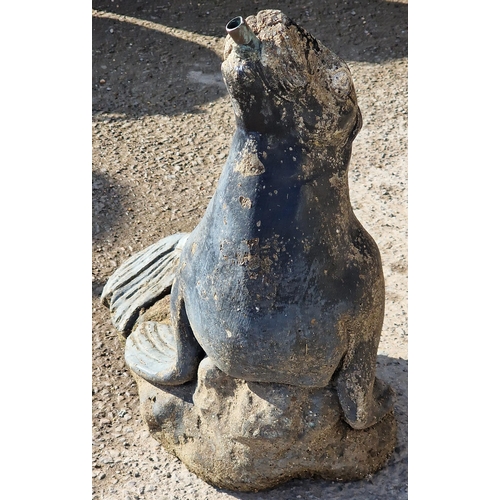 1120 - Weathered reconstituted stone water feature in the form of a seal, 42cm high