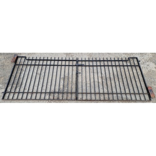 1101 - A pair of iron entrance gates with vertical bars and black painted finish, 131cm high x 363cm wide