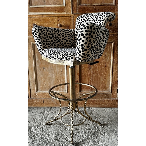 1221 - A pair of upholstered leopard print adjustable bar stools on fancy gilt metal frames.  
Height 97cm ... 