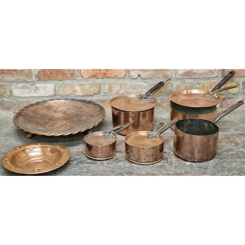 669 - Good collection of lidded copper and iron saucepans, with a good copper twin handled cauldron and la... 