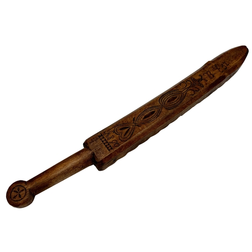 596 - Interesting 19th century Scandinavian mangle board, with incised decoration, 68cm long