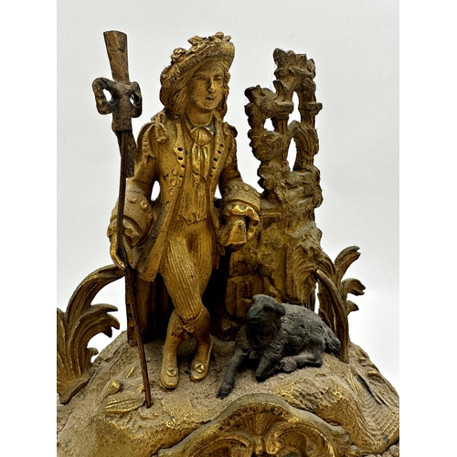 68 - 19th century French gilt spelter figural mantle clock, mounted by a shepherd and sheep, twin train d... 