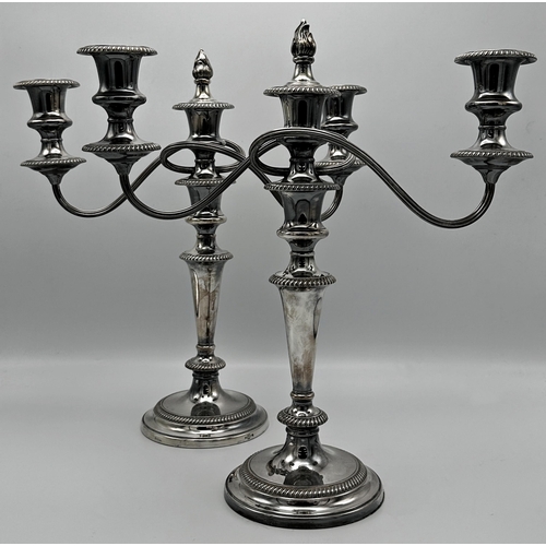 345 - Pair of Harrods Georgian style silver plated twin branch candelabras, 38cm high