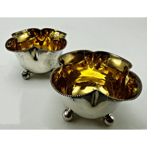 295 - Pair of late Victorian silver lobed salts with gilt interior and ball feet, maker William Hutton and... 