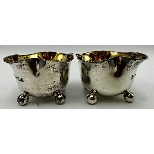 295 - Pair of late Victorian silver lobed salts with gilt interior and ball feet, maker William Hutton and... 