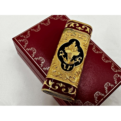 391 - Good gold plated Cartier lighter with Oriental enamelled decoration, in original box with dust bag, ... 