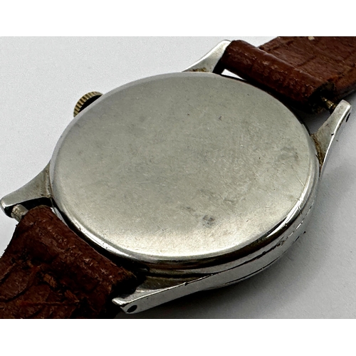 32 - Late 1940s Omega stainless steel gents dress watch, 33mm case, tropical silver dial with gilt hands ... 