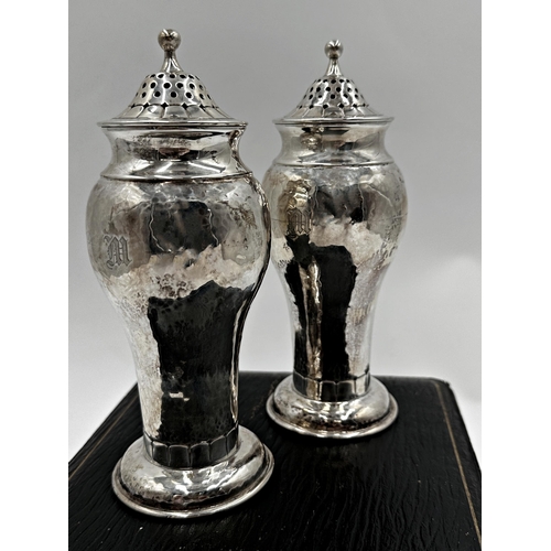 311 - Superior quality cased pair of silver casters, with hammered finish and Art Nouveau foot rim, maker ... 