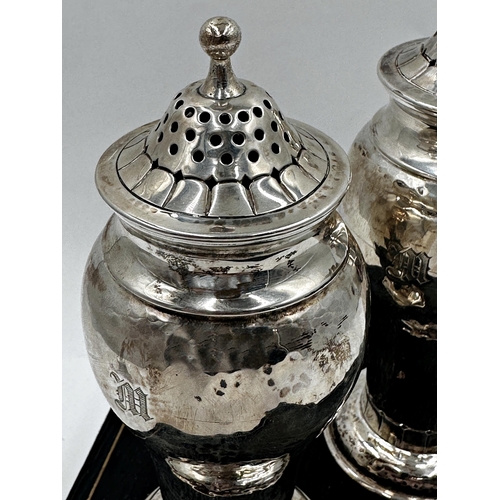 311 - Superior quality cased pair of silver casters, with hammered finish and Art Nouveau foot rim, maker ... 