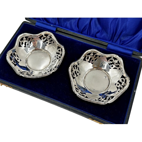 312 - Cased pair of silver trinket dishes, with lobed pierced rims, maker Charles S Green & Co Ltd, Birmin... 