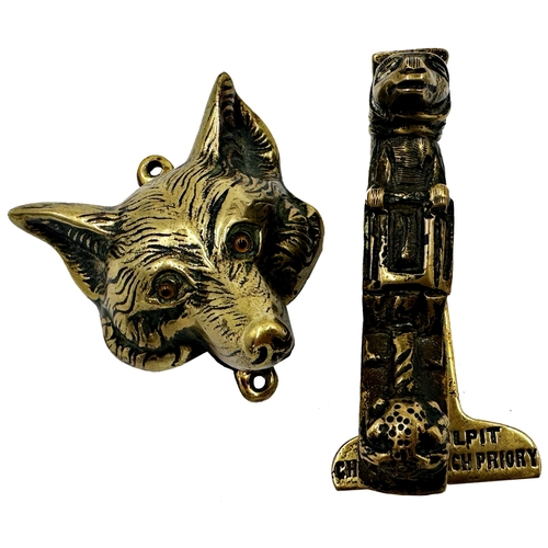 630 - Two Victorian novelty cast brass door knockers, a fox mask with glass eyes, 7 x 6cm and a further 'F... 