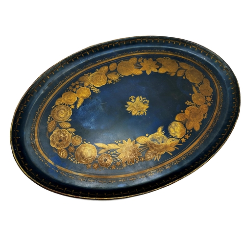 668 - 19th century Pontypool jappaned oval toleware tray, in Sapphire blue, with gilt floral bands, 58cm x... 