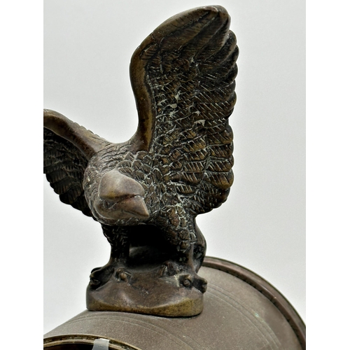 55 - 19th century French bronze and marble portico clocks, mounted by an eagle, twin train painted enamel... 