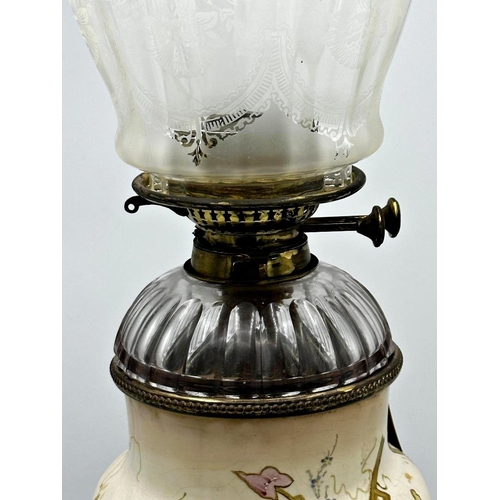 1178 - Late 19th century ceramic oil lamp, with faceted glass reservoir and cast brass base, total height i... 