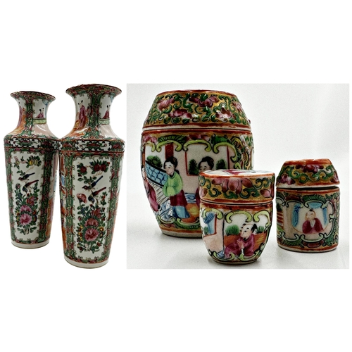 451 - A pair of late 19th century Canton Famille Rose vases, 31cm high, together with three further Famill... 